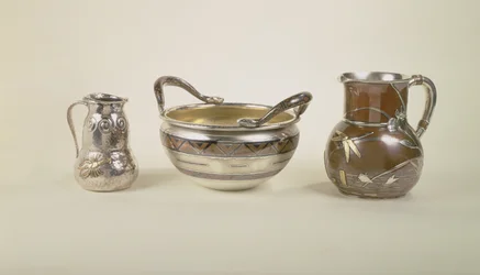 Left: water pitcher with pool scene; Centre: eight pint christening bowl; Right: jug of double gourd form, Tiffany and Co